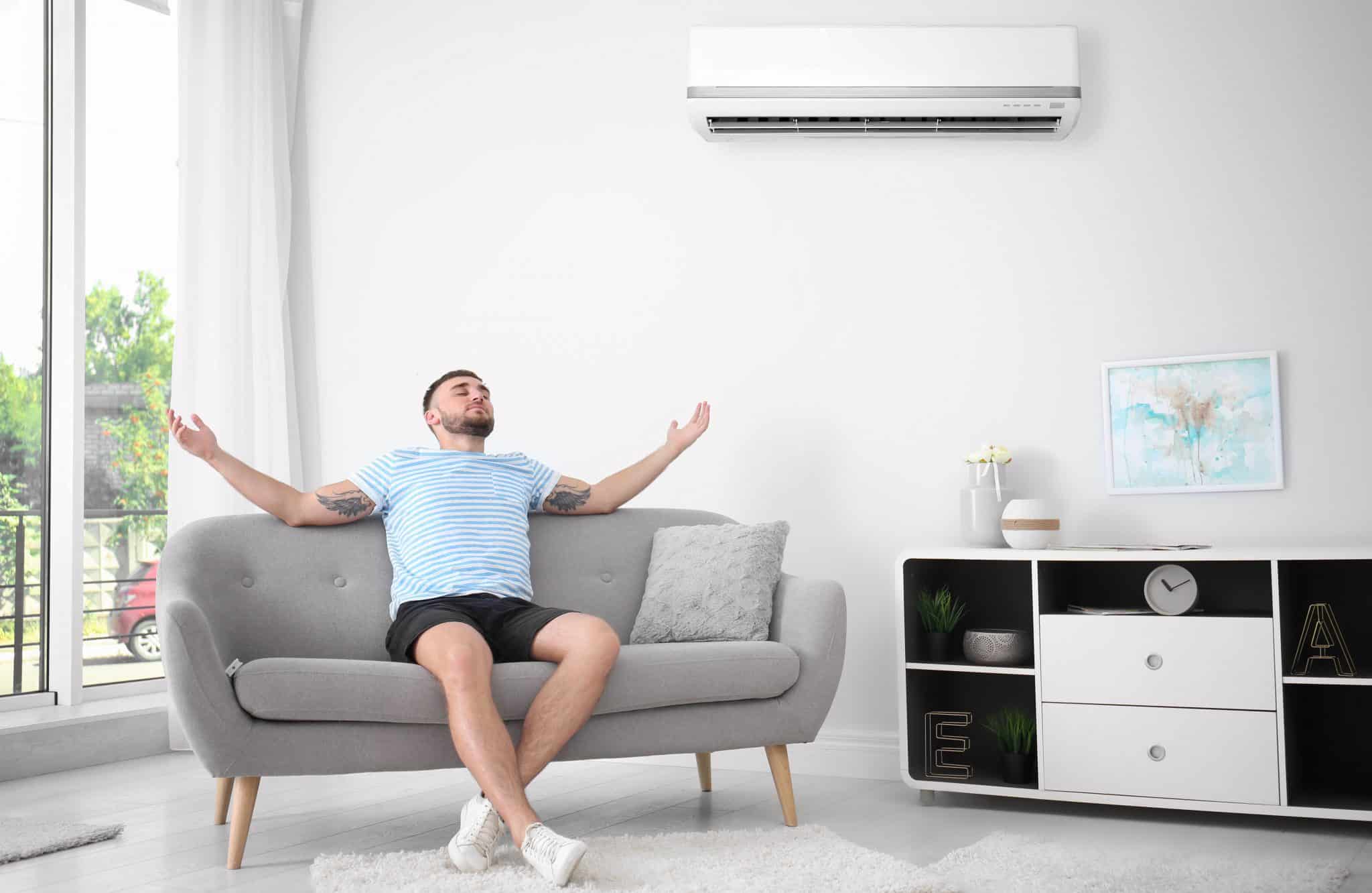 Relaxing man enjoying his Gold Coast air conditioning installation