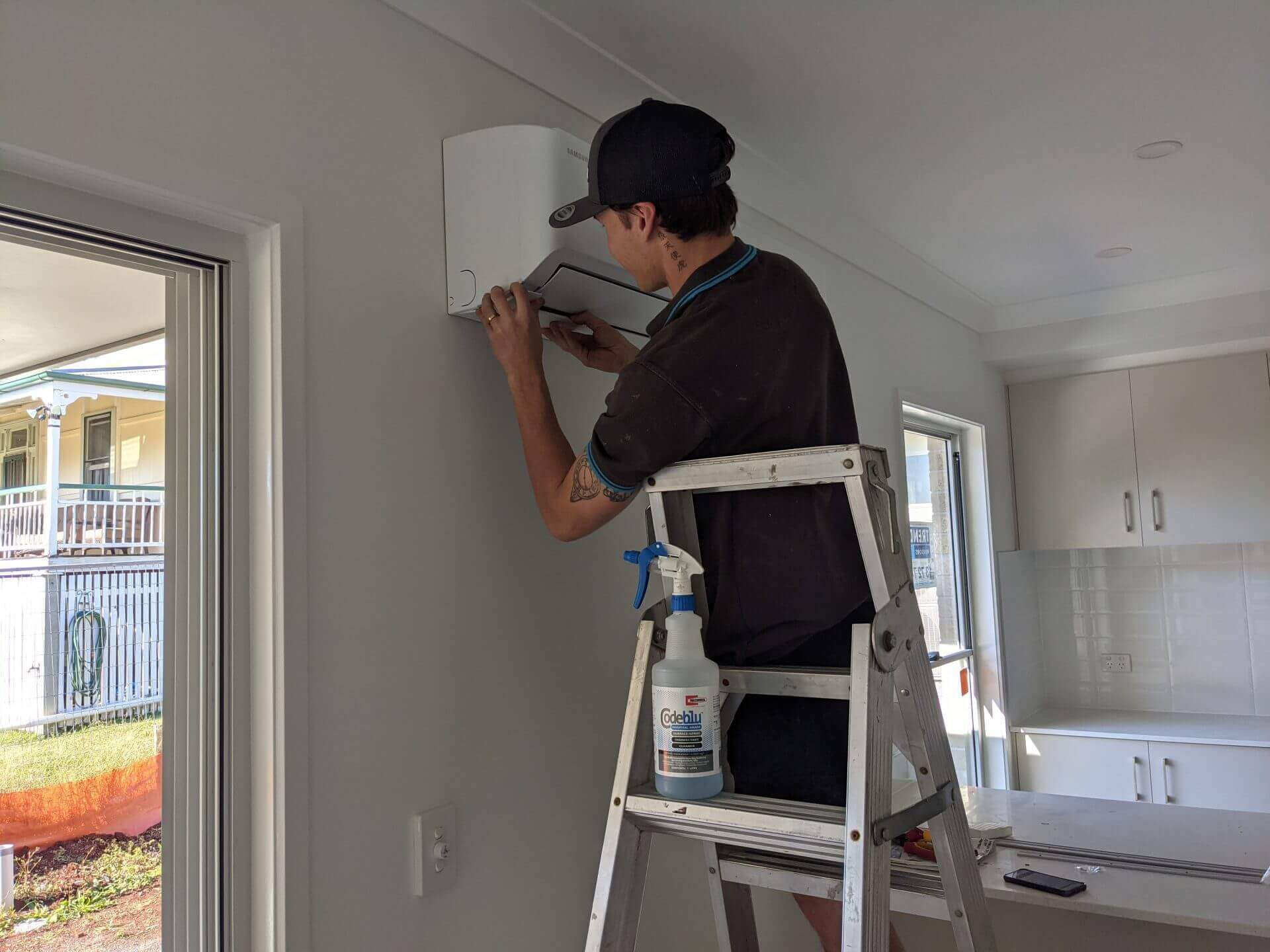 Two men working in attic space