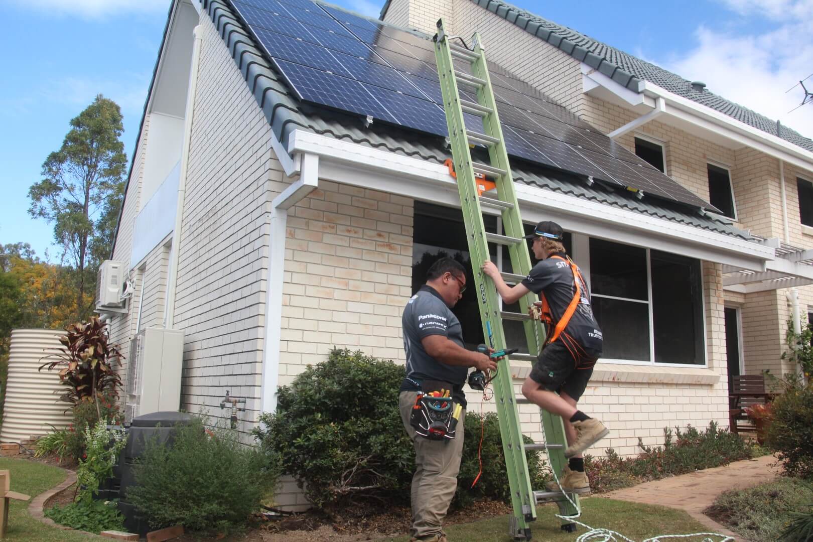solar-panel-electrician-on-roof (5) solar power brisbane installation