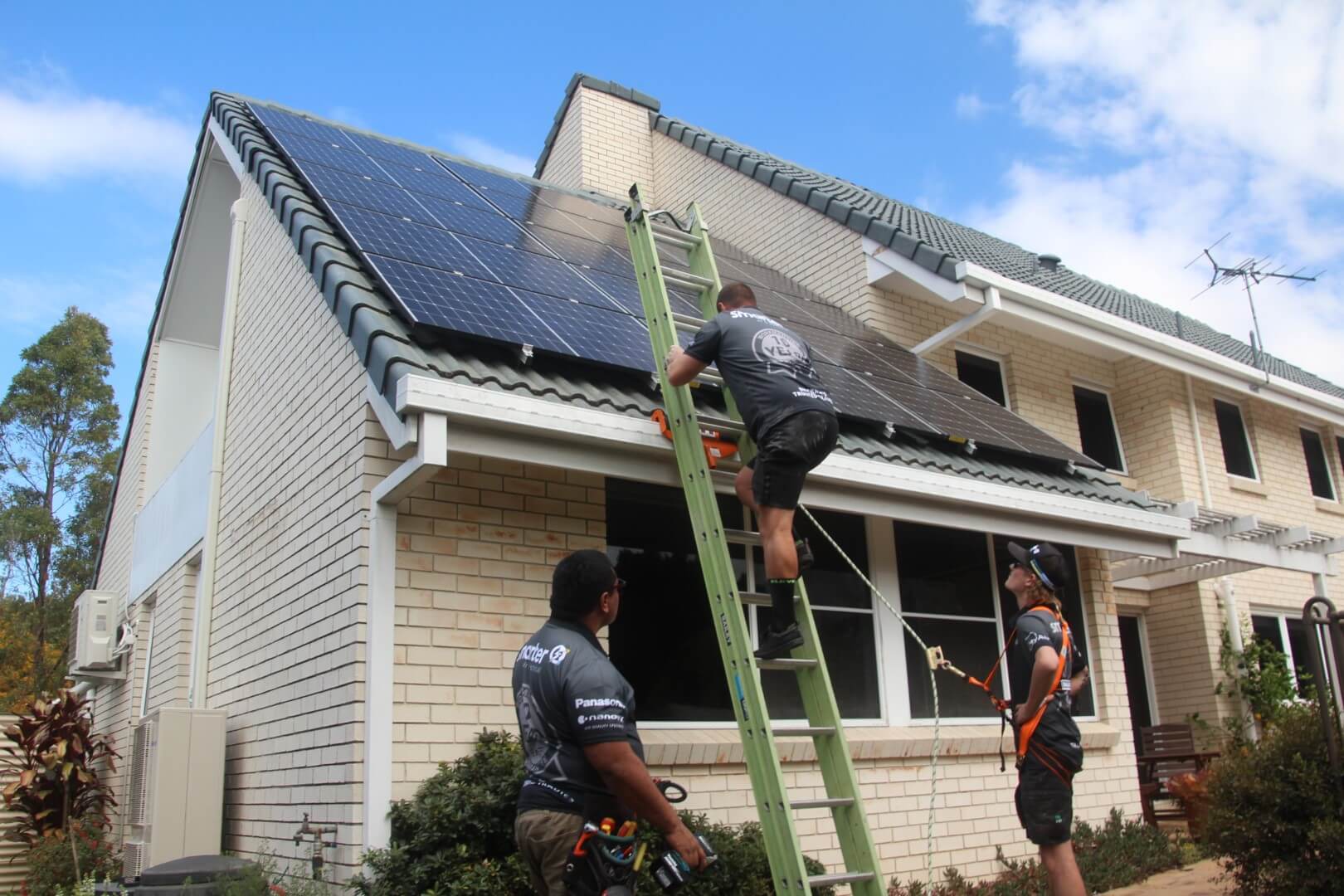 solar-panel-electrician-on-roof (6) solar power brisbane installation